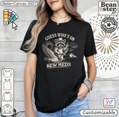 Guess Who’s On New Meds Raccoon Goose Funny Graphic Tee