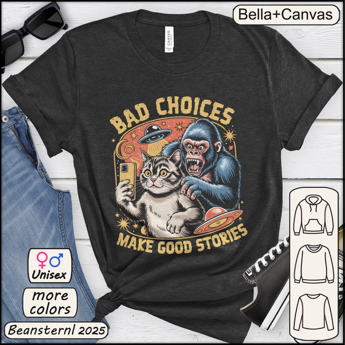 Black t-shirt with a graphic of a cat and monkey taking a selfie with text 'Bad Choices Make Good Stories' on a white background.