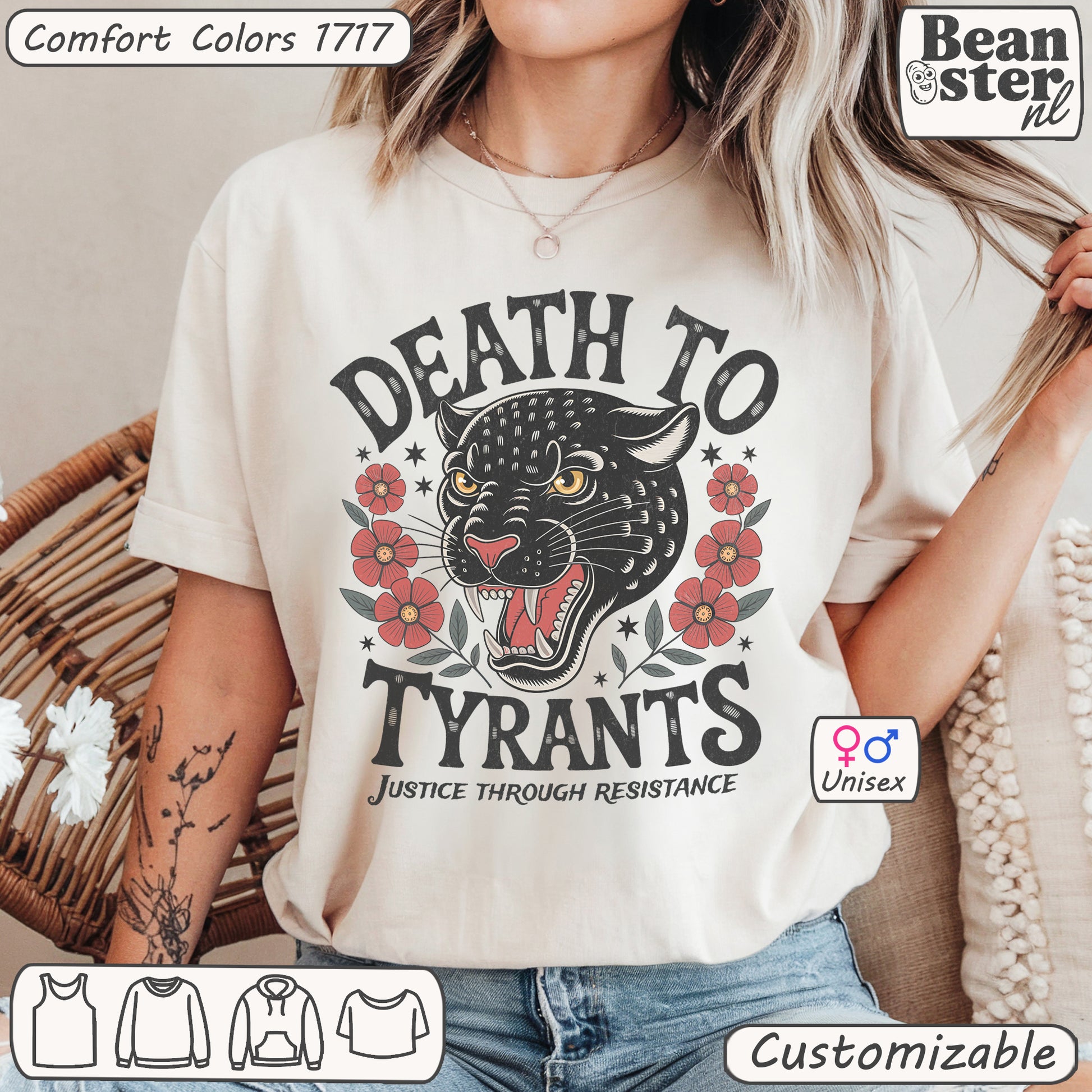 Person wearing a t-shirt with a graphic design and text, standing in front of a neutral background.