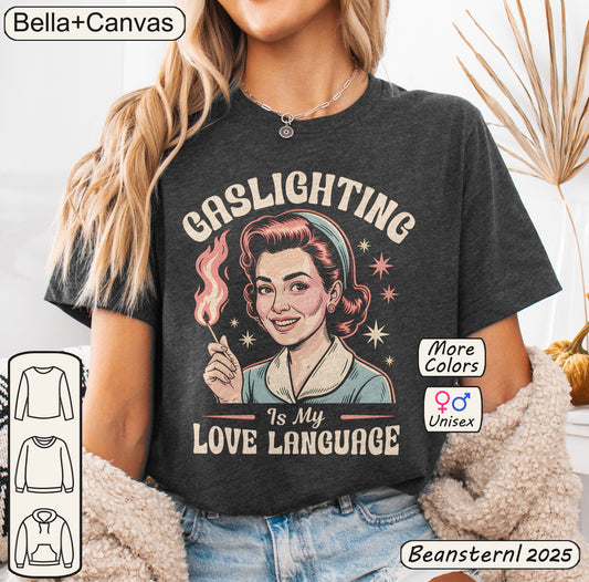 Person wearing a t-shirt with 'Gaslighting is my love language' design, featuring the brand 'Bella+Canvas'.