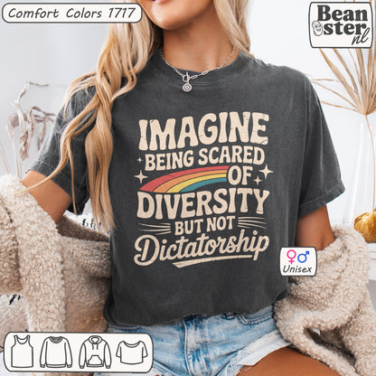Person wearing a t-shirt with a message about diversity and dictatorship, sitting on a couch.