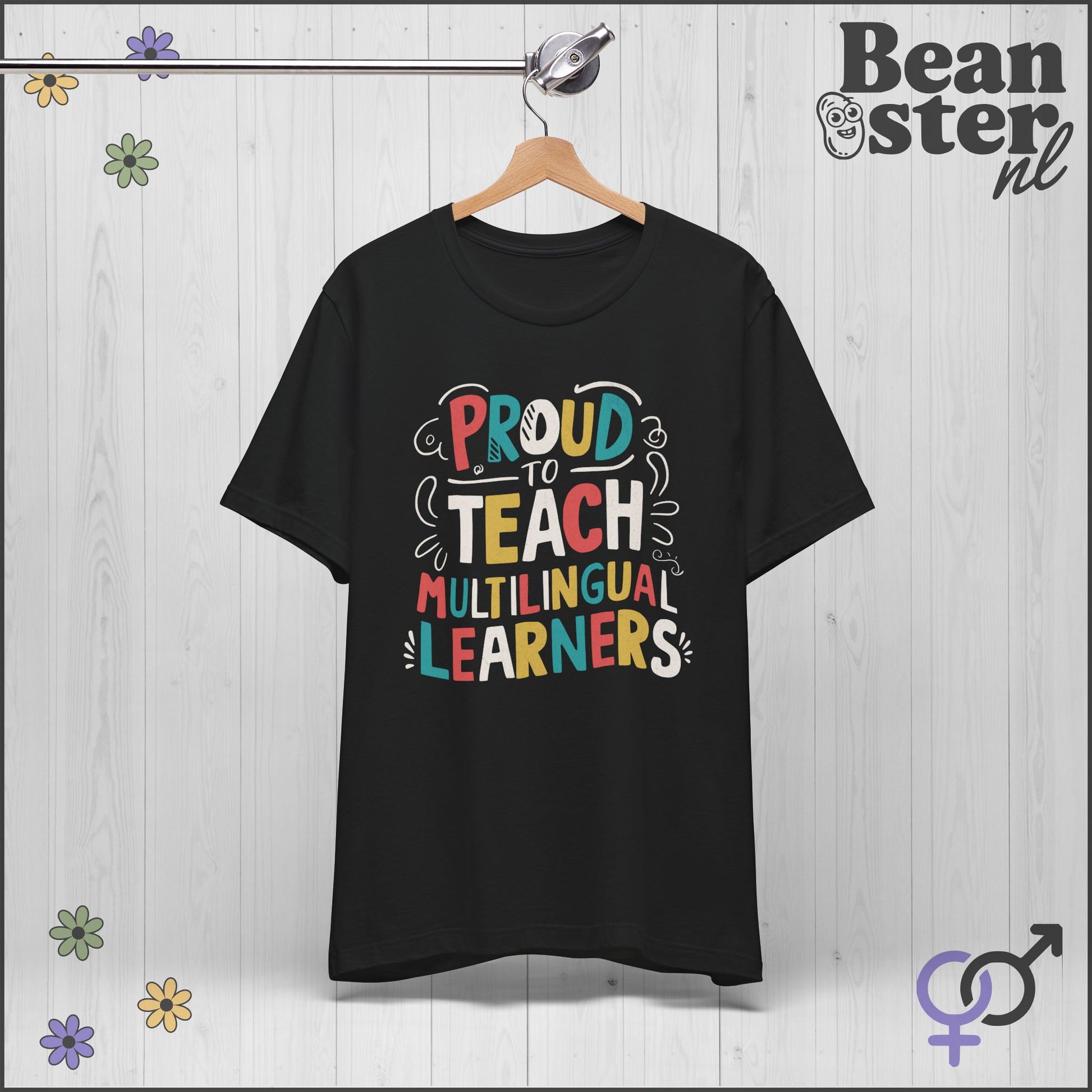 Black t-shirt with colorful text 'Proud to Teach Multilingual Learners' on a wooden background with flowers.