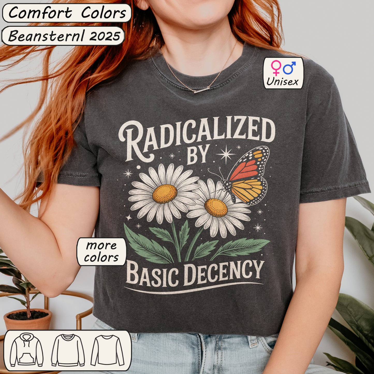 Person wearing a t-shirt with a graphic design and text, standing indoors.