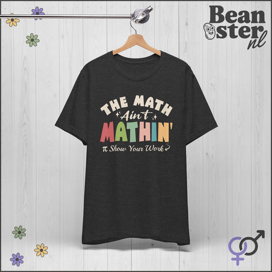 Black t-shirt with colorful text on a hanger against a light wooden background