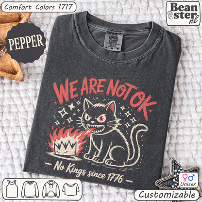 Dark gray t-shirt with red and white graphic design on a textured surface