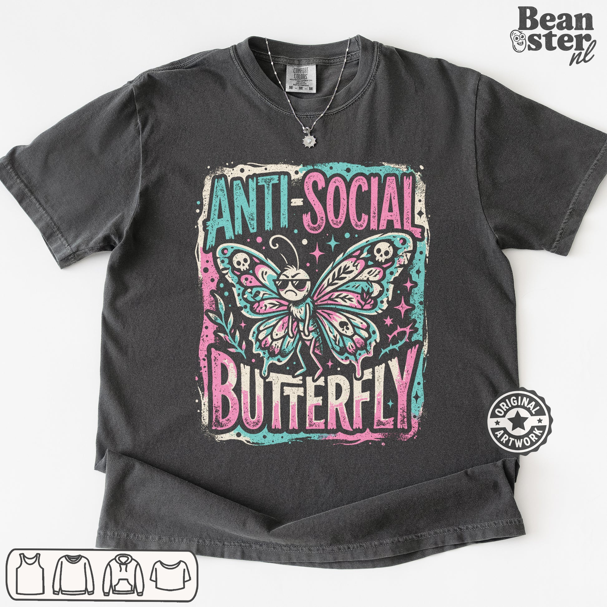 A dark gray graphic t-shirt featuring a distressed print of a butterfly with sunglasses and the text 'ANTI-SOCIAL BUTTERFLY' in pink and teal. The t-shirt is laid flat on a white background with a Beanster.
