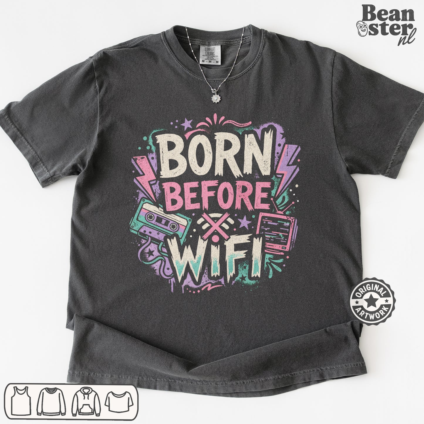 A dark gray graphic t-shirt featuring the text 'BORN BEFORE WIFI' in a retro neon style with cassette tapes and lightning bolts. 