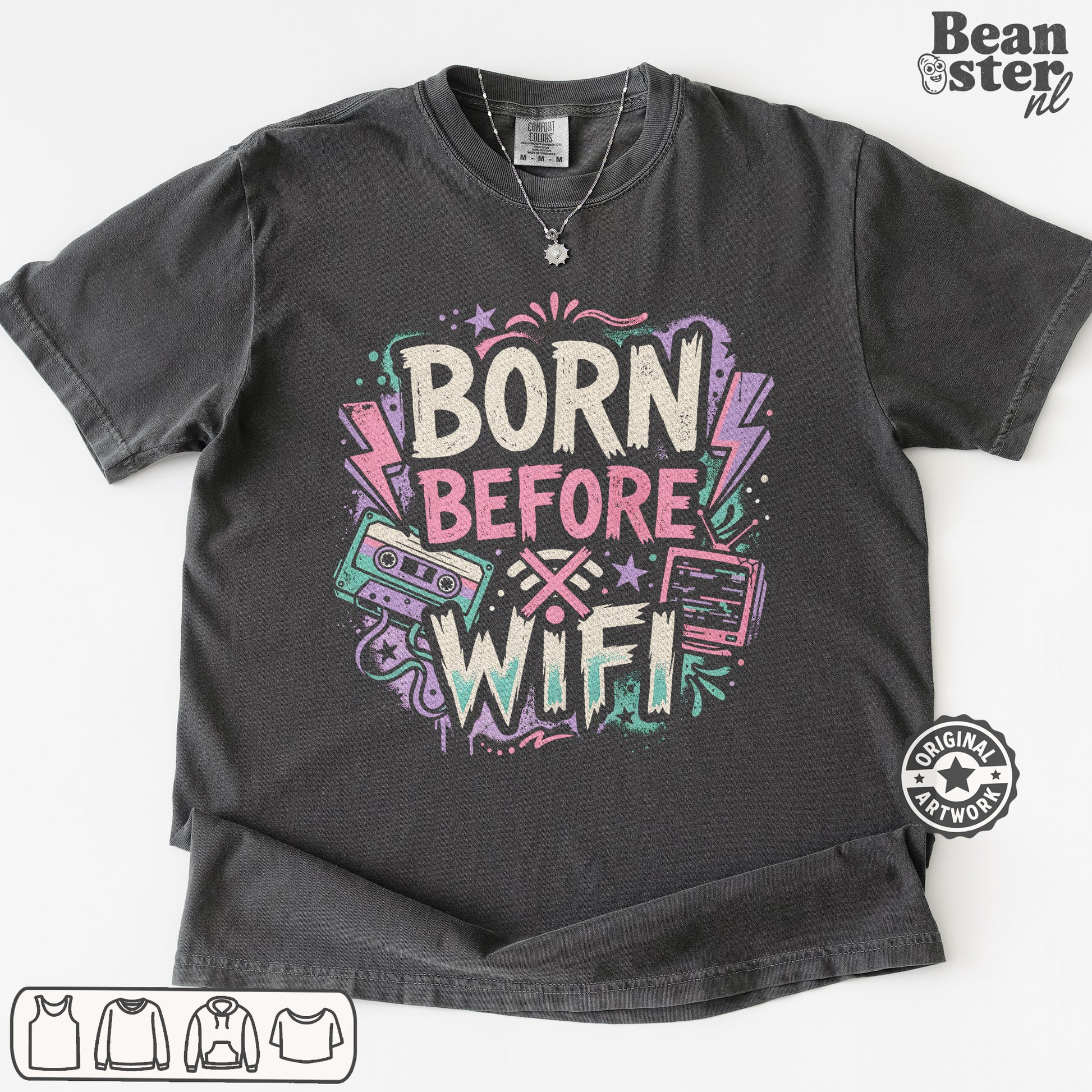 A dark gray graphic t-shirt featuring the text 'BORN BEFORE WIFI' in a retro neon style with cassette tapes and lightning bolts. 