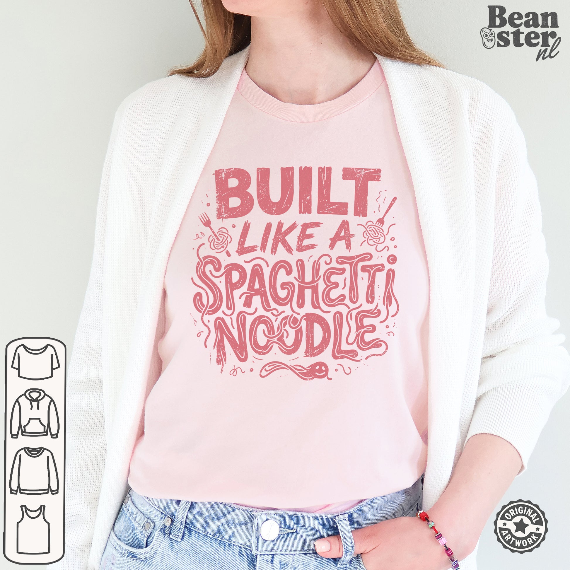 A woman wearing a light pink crewneck t-shirt with a red graphic that reads 'BUILT LIKE A SPAGHETTI NOODLE', styled with a white cardigan and blue jeans. The brand logo 'Bean ster nl' is visible in the top right corner.