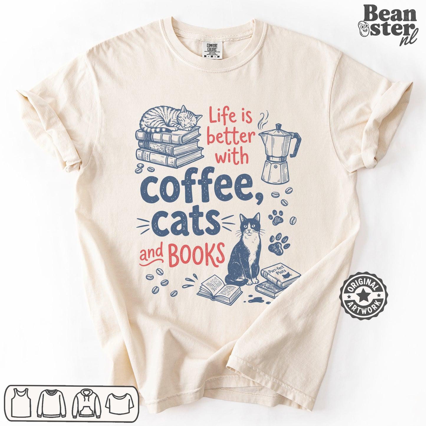 A cream-colored short-sleeve t-shirt with a graphic print that reads 'Life is better with coffee, cats and BOOKS' in red and navy blue text, accompanied by illustrations of a sleeping cat on books, a coffee maker, a sitting cat, and paw prints. The brand logo 'Beanster nl' is visible in the top right corner.