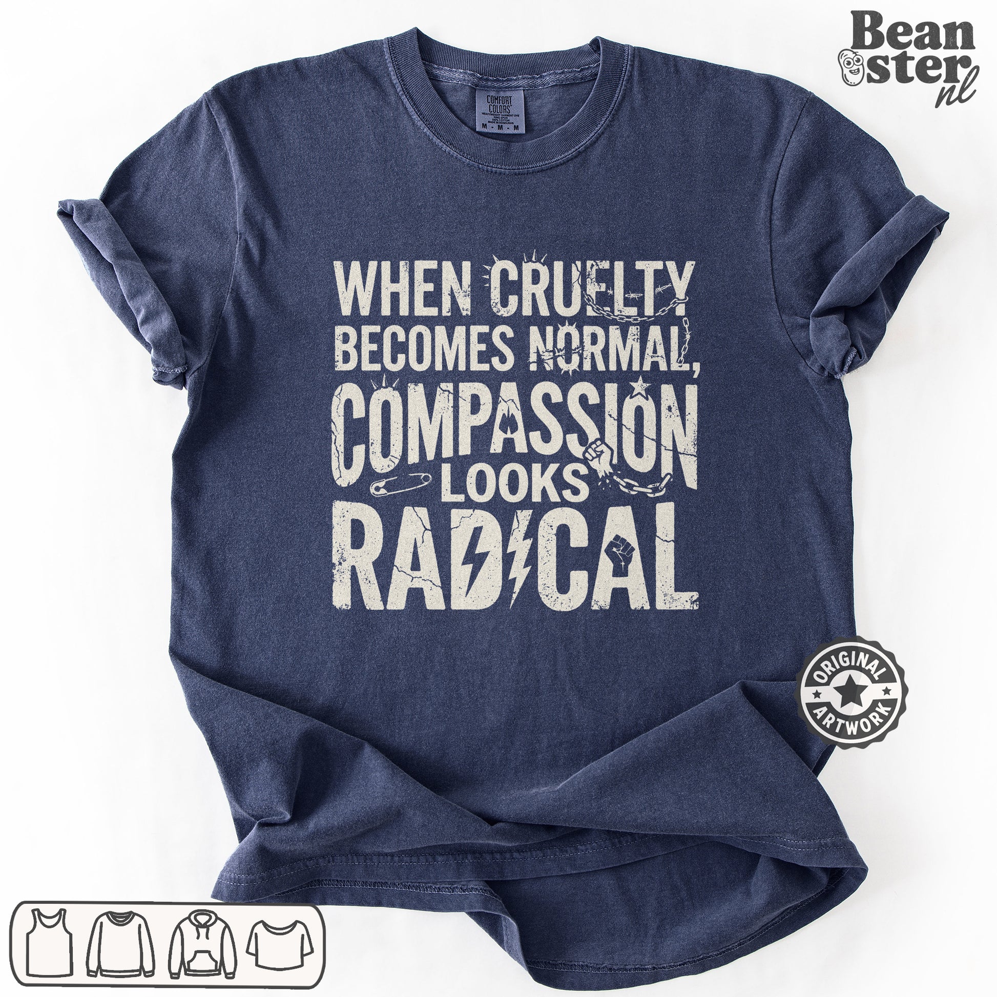 A navy blue short-sleeve t-shirt with a distressed white graphic text that reads 'WHEN CRUELTY BECOMES NORMAL, COMPASSION LOOKS RADICAL' accompanied by a small chain and lightning bolt design. The t-shirt is displayed on a clean white background with a 'Beanster.