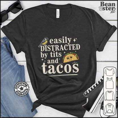 Black t-shirt with 'easily distracted by tits and tacos' text and graphic, displayed with jeans and sunglasses.