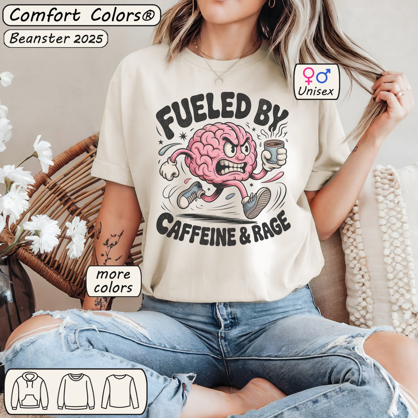 Person wearing a t-shirt with a graphic design of a brain holding a coffee cup and text 'Fueled by Caffeine & Rage' in a casual setting.