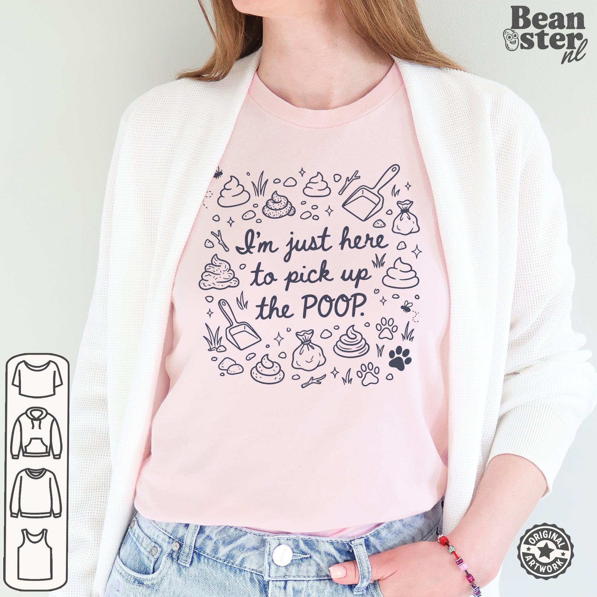 A woman wearing a light pink graphic t-shirt with a black line art design of poop icons and the text 'I'm just here to pick up the POOP'. She is wearing a white cardigan and blue jeans.