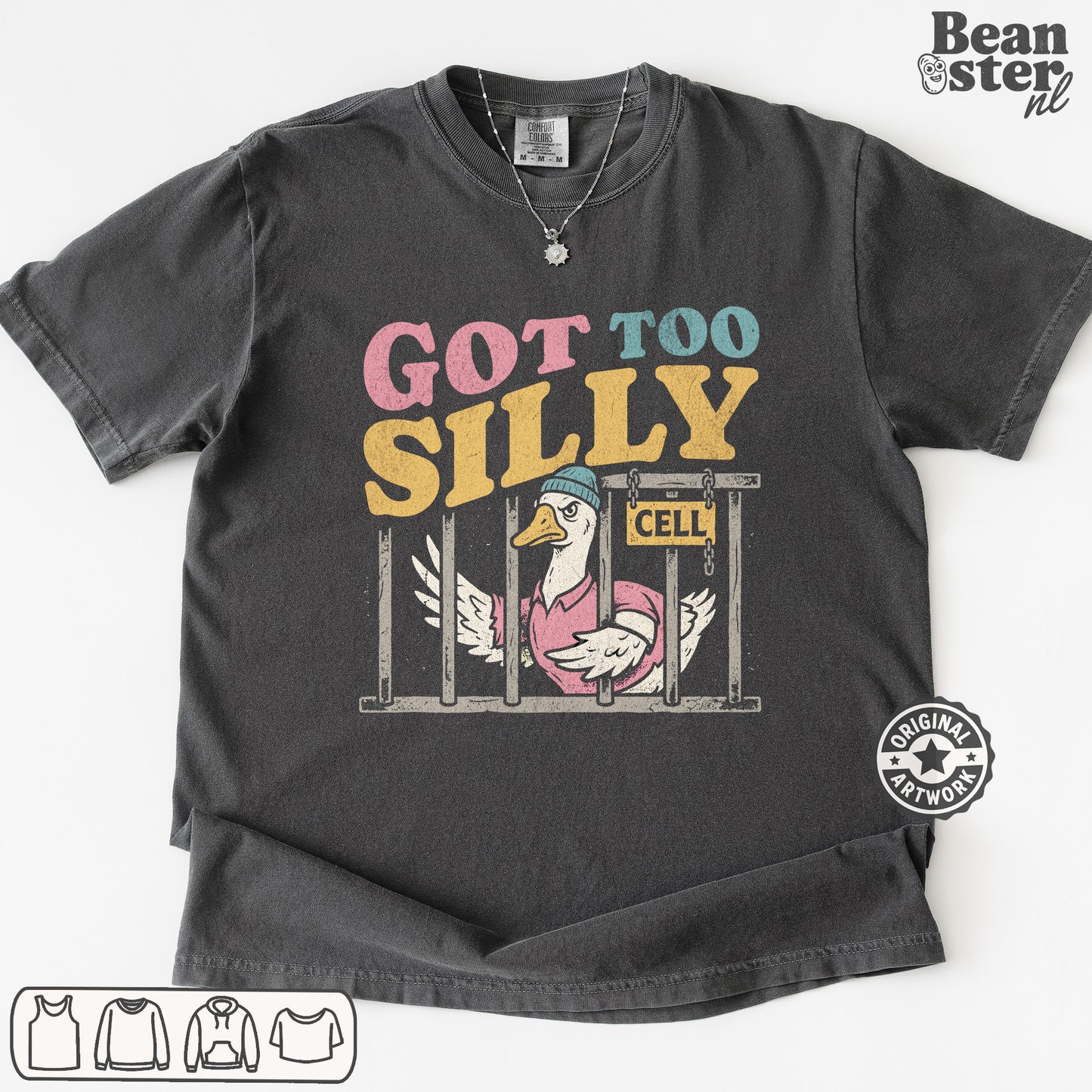 A dark gray graphic t-shirt featuring a cartoon duck in a pink pig costume behind bars with the text 'GOT TOO SILILY' in pink, blue, and yellow. The t-shirt is displayed flat against a white background with a 'Beanster nl' watermark in the top right corner.