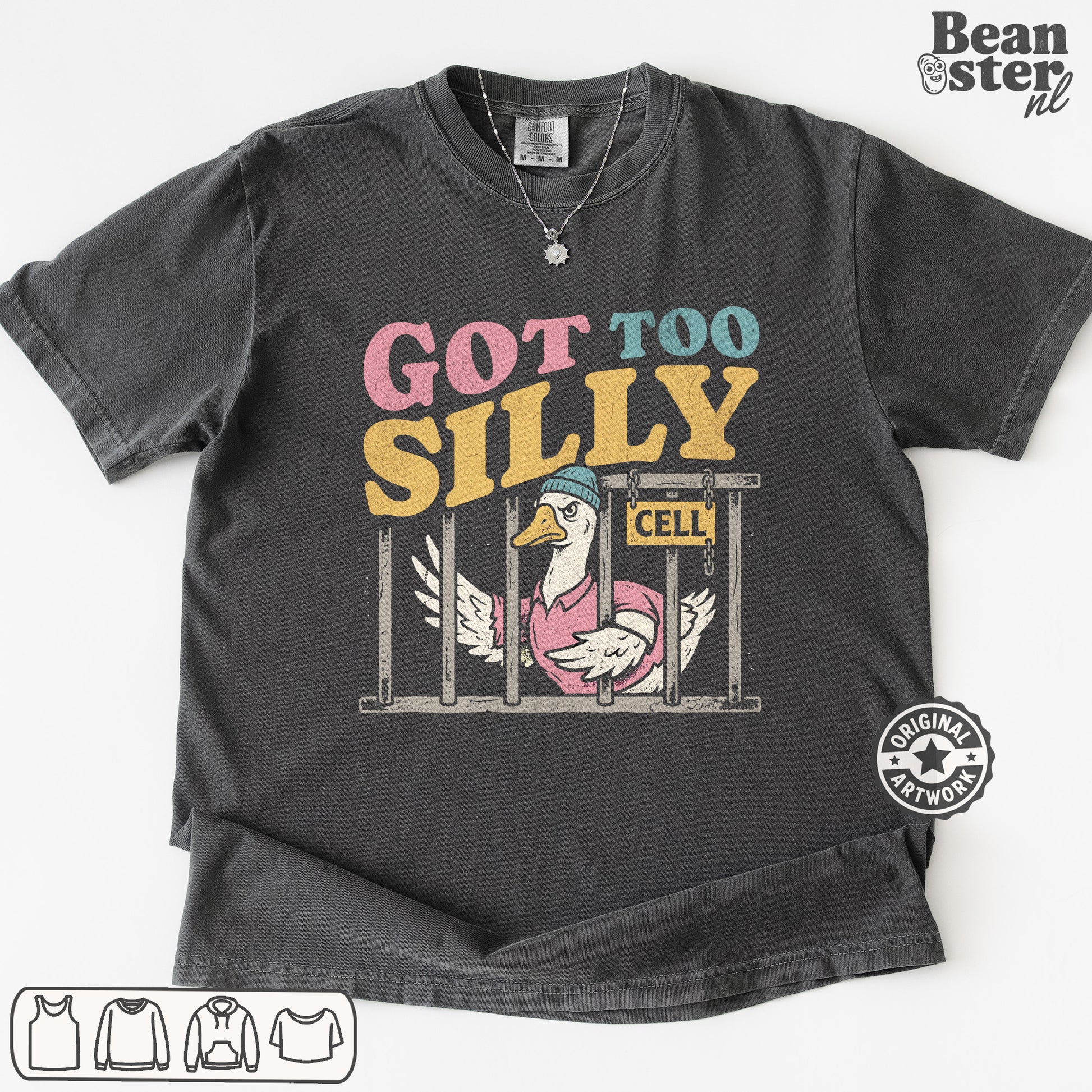 A dark gray graphic t-shirt featuring a cartoon duck in a pink pig costume behind bars with the text 'GOT TOO SILILY' in pink, blue, and yellow. The t-shirt is displayed flat against a white background with a 'Beanster nl' watermark in the top right corner.