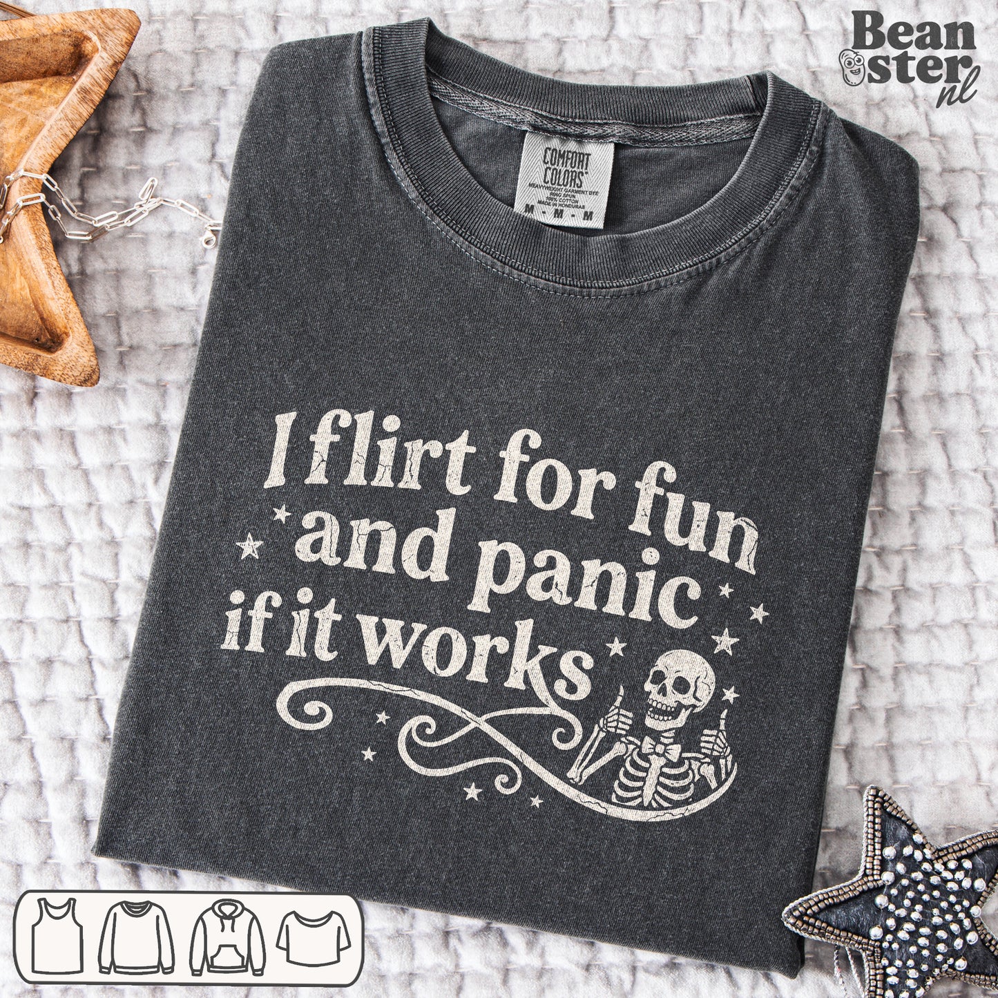 Black graphic tee reading “I Flirt For Fun And Panic When It Works” styled on model in casual streetwear