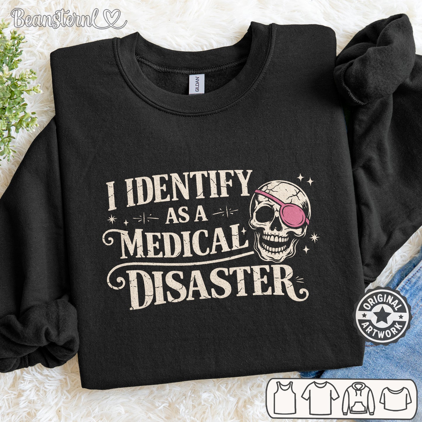 Black sweatshirt with skull design and text 'I identify as a medical disaster' on a textured surface.