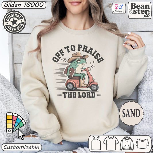 Off To Praise The Lord sweater with silly frog on scooter graphic