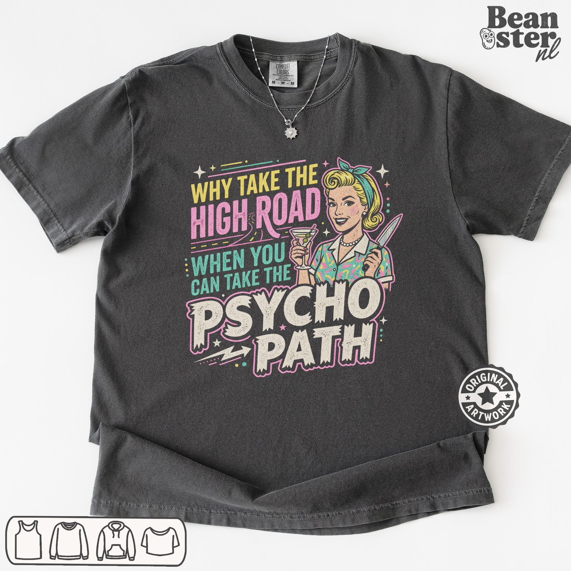 A dark charcoal gray graphic t-shirt laid flat on a white background. The shirt features a retro-style pin-up illustration of a woman with blonde hair and a headband, holding a drink, next to the text 'WHY TAKE THE HIGH ROAD WHEN YOU CAN TAKE THE PSYCHO PATH' in pink, yellow, and teal lettering.