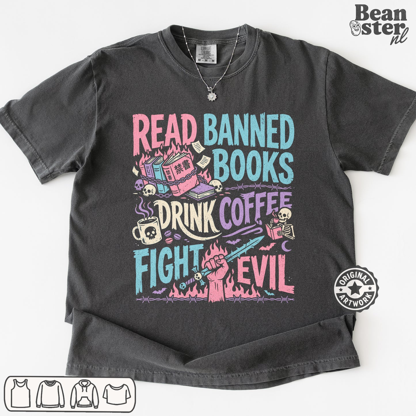 A dark gray graphic t-shirt featuring a colorful design with the text 'READ BANNED BOOKS DRINK COFFEE FIGHT EVIL' and illustrations of a library, coffee cup, skull, and book. The t-shirt is displayed flat against a white background with a 'Beanster.