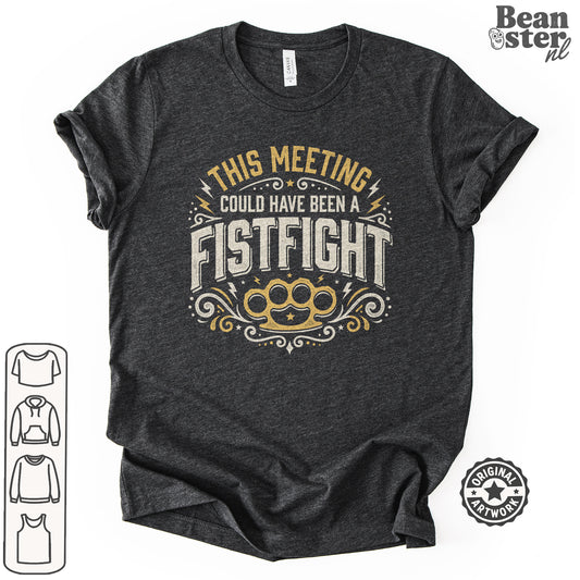 A dark heather gray graphic t-shirt featuring the text 'THIS MEETING COULD HAVE BEEN A FISTFIGHT' in distressed cream and gold lettering, with a gold brass knuckle graphic below. The t-shirt is displayed on a clean white background with a 'Beanster.
