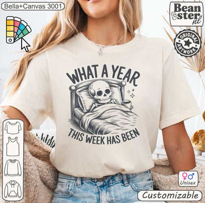 Skeleton graphic t-shirt with text “What A Week This Year Has Been” – dark humour, funny 2026 shirt